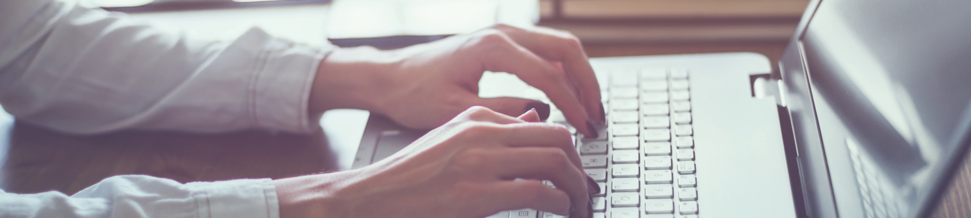 A women typing on her laptop